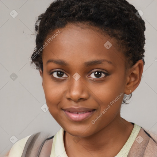 Joyful black child female with short  brown hair and brown eyes