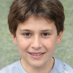 Joyful white child male with short  brown hair and brown eyes