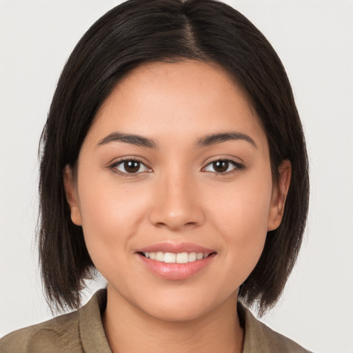 Joyful white young-adult female with medium  brown hair and brown eyes