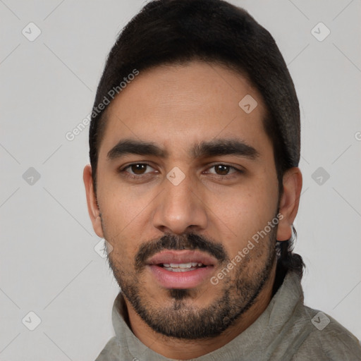 Neutral latino young-adult male with short  black hair and brown eyes