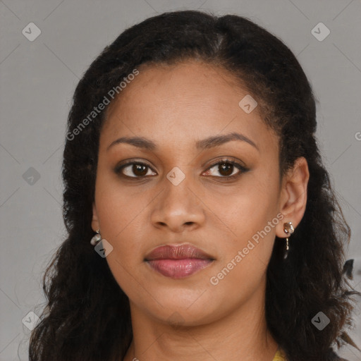 Joyful black young-adult female with long  brown hair and brown eyes