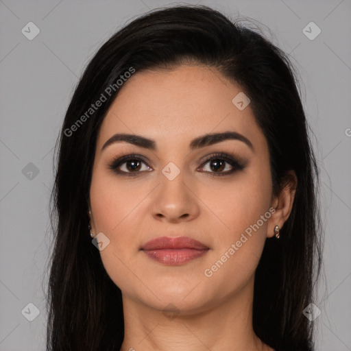 Joyful latino young-adult female with long  brown hair and brown eyes