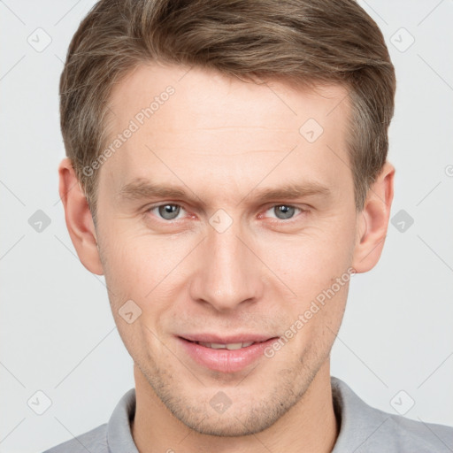 Joyful white adult male with short  brown hair and grey eyes