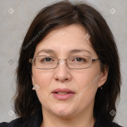 Joyful white adult female with medium  brown hair and brown eyes