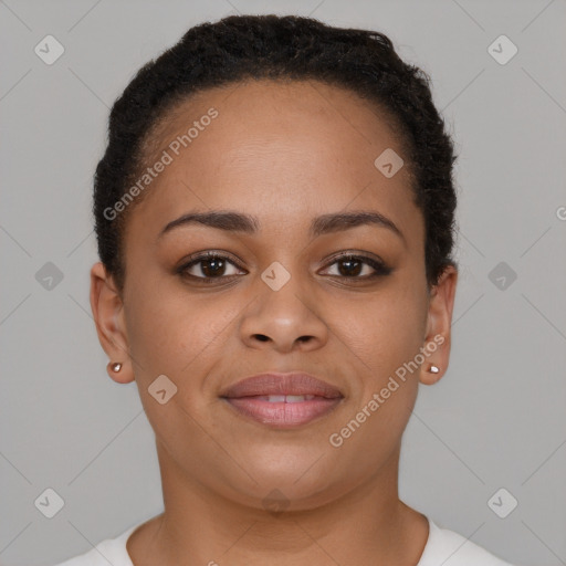 Joyful black young-adult female with short  brown hair and brown eyes