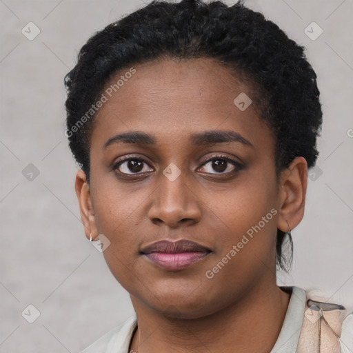 Joyful black young-adult female with short  black hair and brown eyes