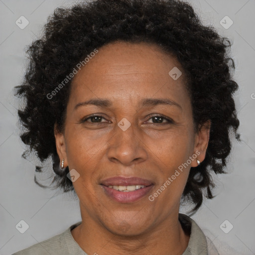 Joyful black adult female with short  brown hair and brown eyes