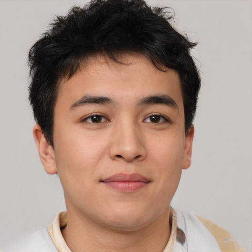 Joyful asian young-adult male with short  brown hair and brown eyes