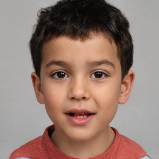 Joyful white child male with short  brown hair and brown eyes