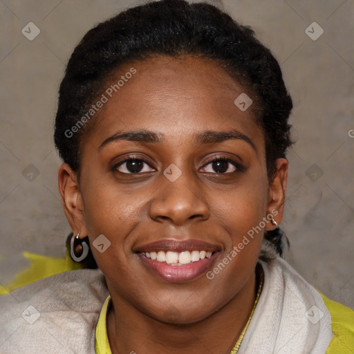 Joyful black young-adult female with short  brown hair and brown eyes