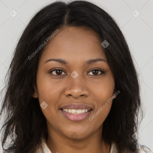 Joyful black young-adult female with long  brown hair and brown eyes