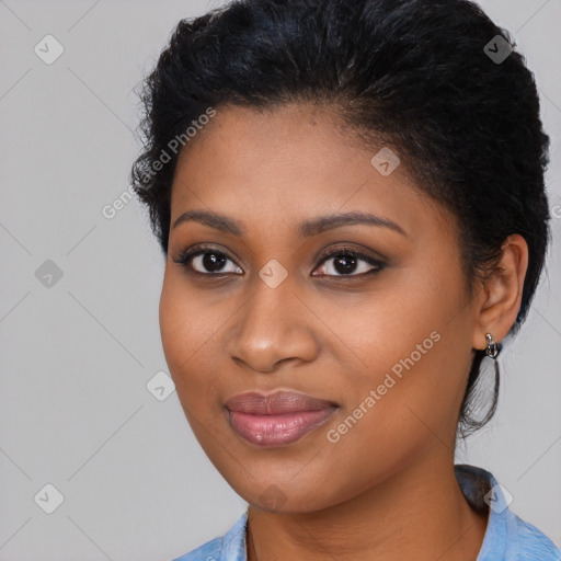 Joyful black young-adult female with medium  black hair and brown eyes