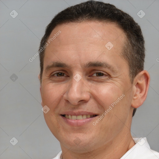 Joyful white adult male with short  brown hair and brown eyes