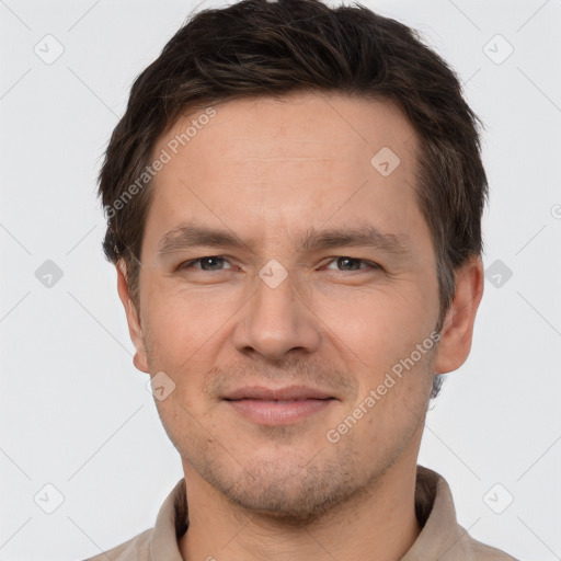 Joyful white adult male with short  brown hair and brown eyes