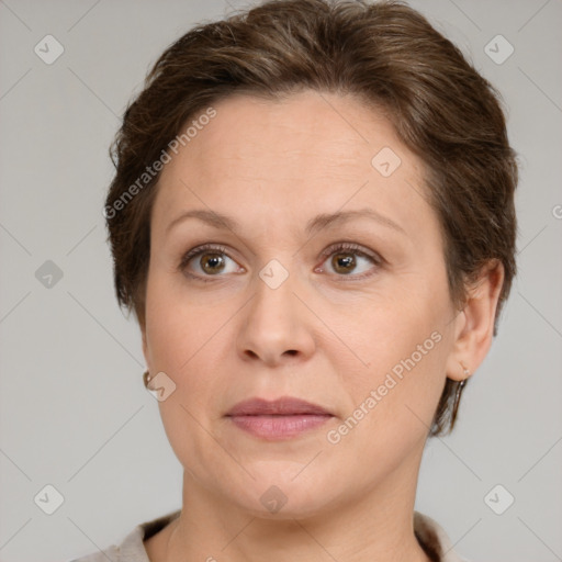 Joyful white adult female with short  brown hair and grey eyes