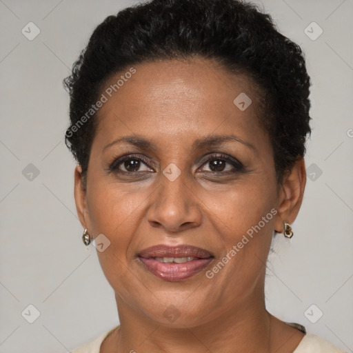 Joyful black adult female with short  brown hair and brown eyes