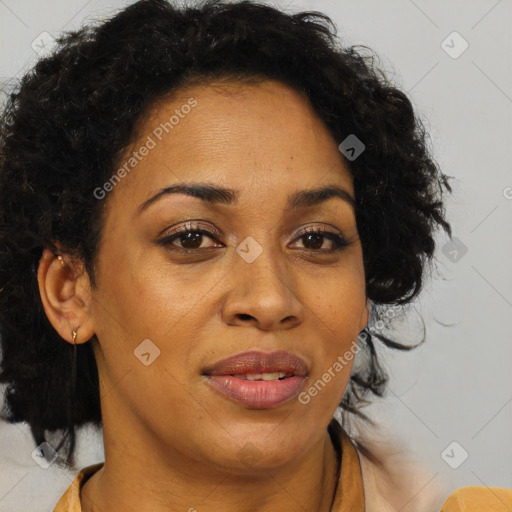 Joyful black adult female with medium  brown hair and brown eyes