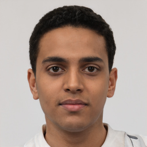 Neutral latino young-adult male with short  black hair and brown eyes