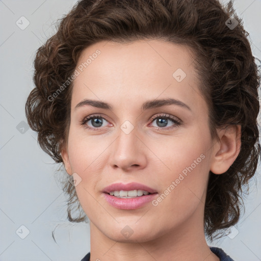 Joyful white young-adult female with medium  brown hair and green eyes