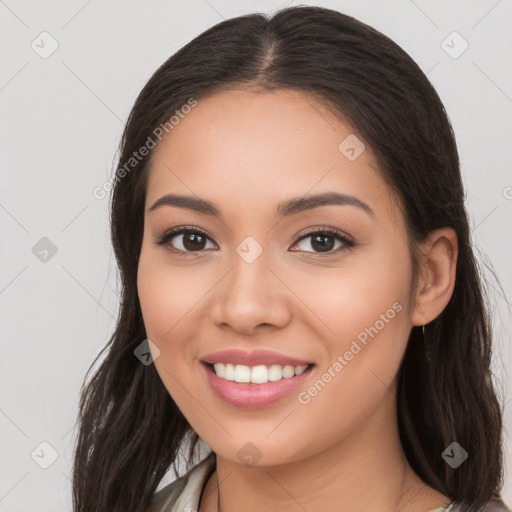 Joyful white young-adult female with long  brown hair and brown eyes