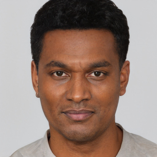 Neutral black young-adult male with short  black hair and brown eyes