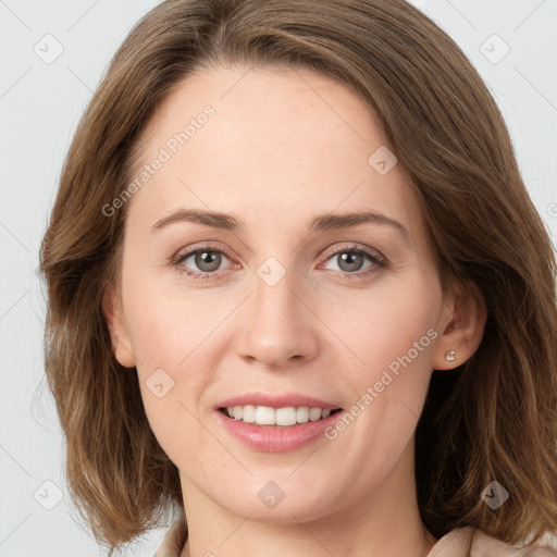 Joyful white young-adult female with long  brown hair and green eyes