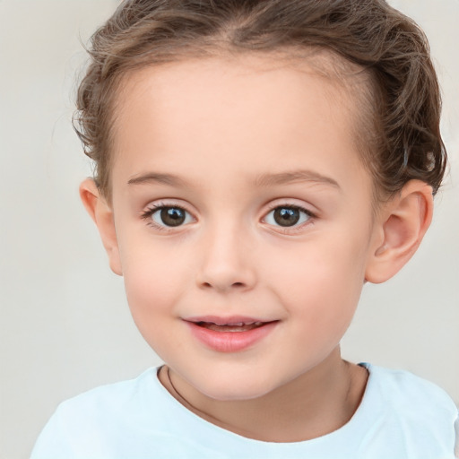 Joyful white child female with short  brown hair and brown eyes