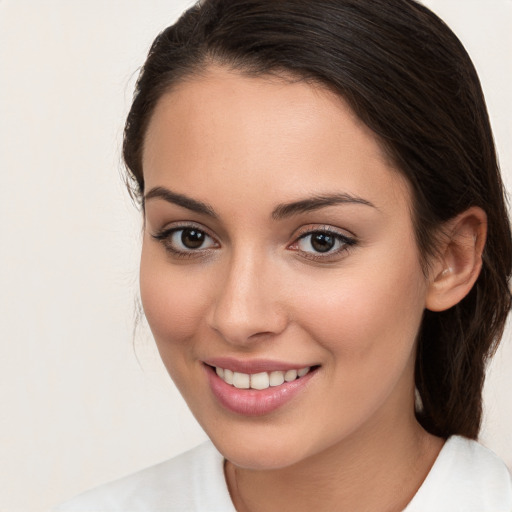 Joyful white young-adult female with medium  brown hair and brown eyes