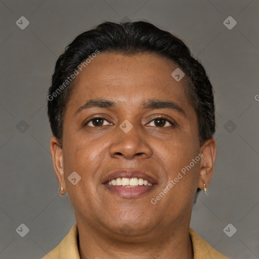 Joyful latino adult male with short  brown hair and brown eyes