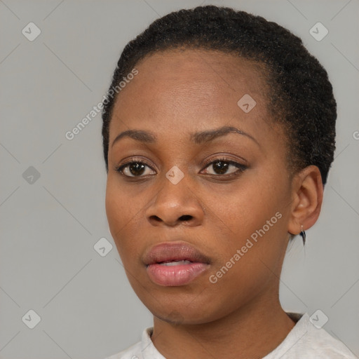 Neutral black young-adult female with short  brown hair and brown eyes