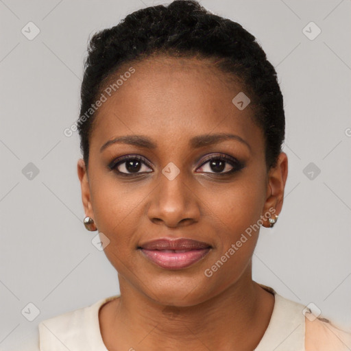 Joyful black young-adult female with short  black hair and brown eyes