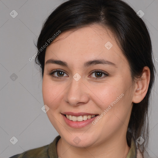 Joyful white young-adult female with medium  brown hair and brown eyes