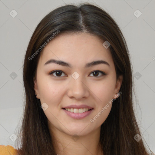 Joyful asian young-adult female with long  brown hair and brown eyes