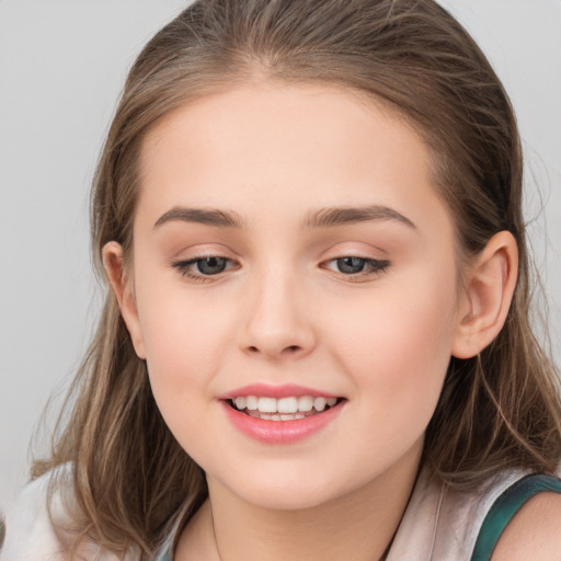 Joyful white child female with long  brown hair and brown eyes