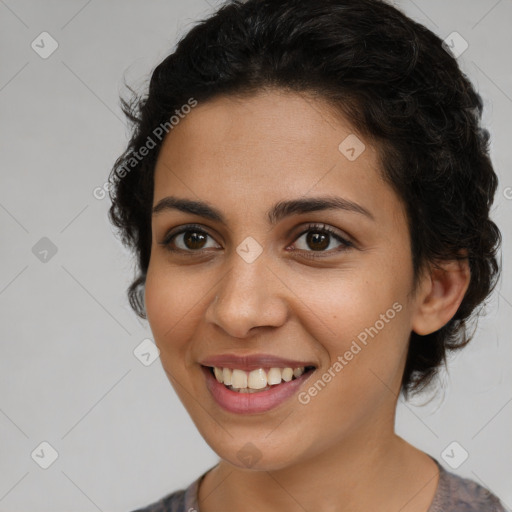 Joyful latino young-adult female with medium  brown hair and brown eyes