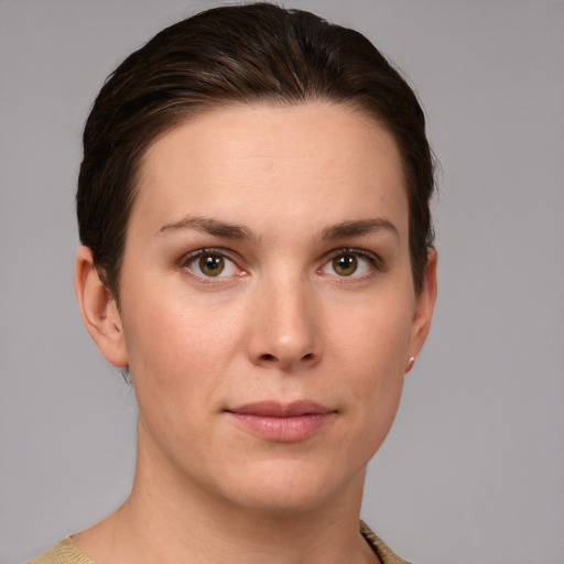 Joyful white young-adult female with short  brown hair and grey eyes