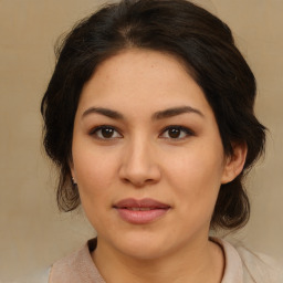 Joyful asian young-adult female with medium  brown hair and brown eyes