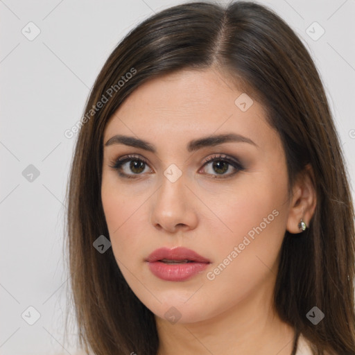 Neutral white young-adult female with long  brown hair and brown eyes