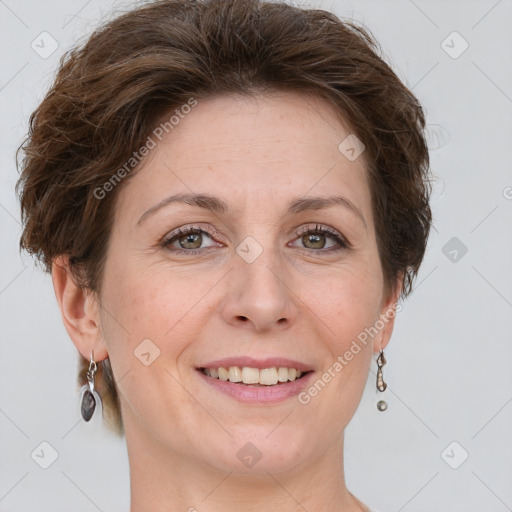 Joyful white adult female with short  brown hair and grey eyes