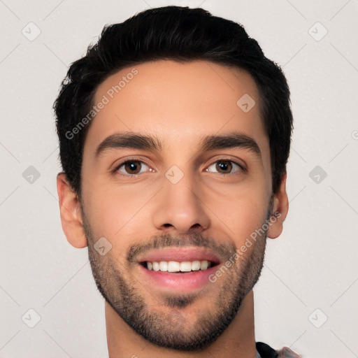 Joyful white young-adult male with short  black hair and brown eyes