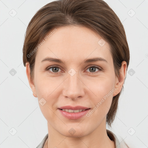 Joyful white young-adult female with medium  brown hair and grey eyes