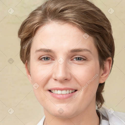 Joyful white young-adult female with medium  brown hair and grey eyes