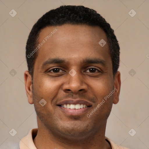 Joyful latino young-adult male with short  brown hair and brown eyes