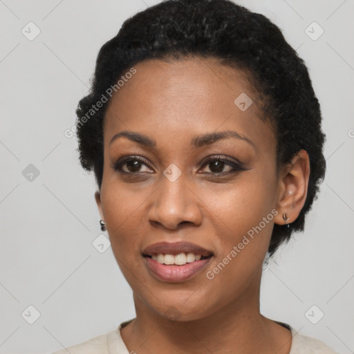 Joyful black young-adult female with short  black hair and brown eyes