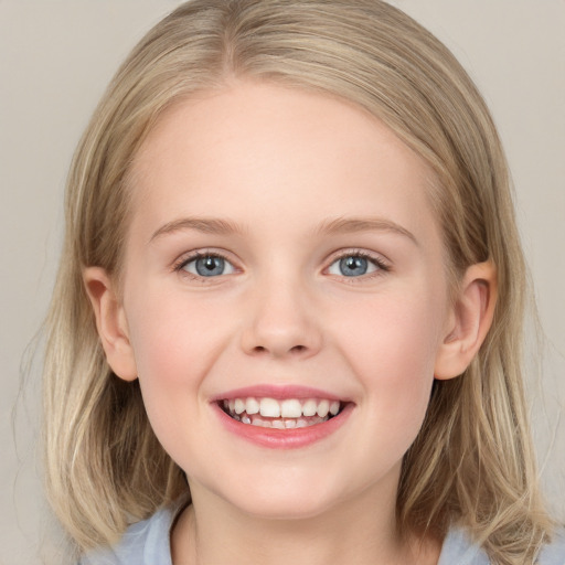 Joyful white child female with medium  brown hair and blue eyes