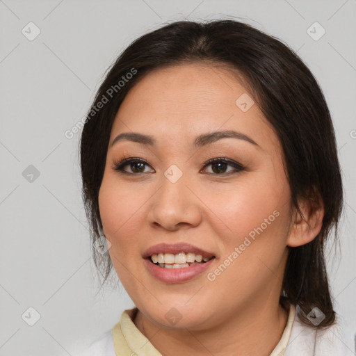 Joyful latino young-adult female with medium  brown hair and brown eyes