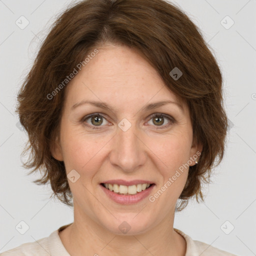 Joyful white adult female with medium  brown hair and green eyes