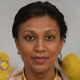Joyful black adult female with short  brown hair and brown eyes