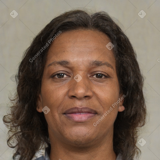 Joyful black adult female with medium  brown hair and brown eyes