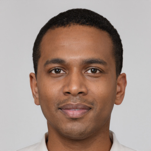 Neutral black young-adult male with short  black hair and brown eyes